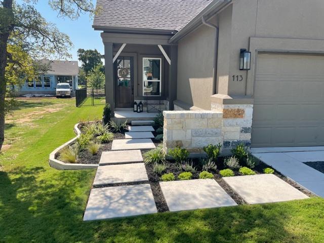 Front entrance landscaping with stone pavers