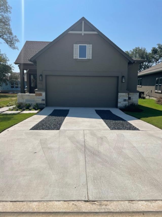 Modern driveway with decorative concrete and gravel